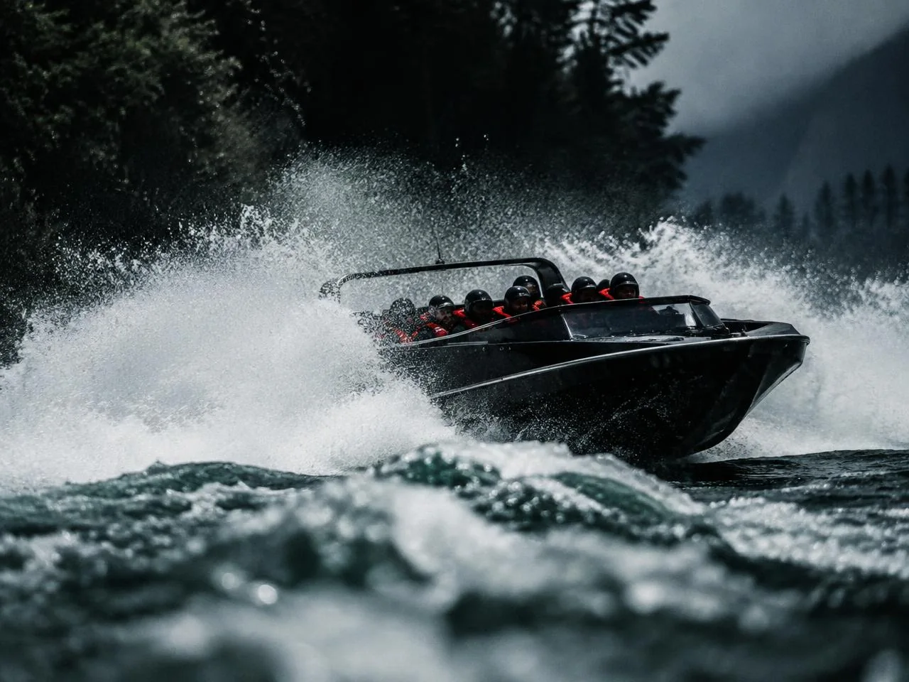 River jetboat racing through churning white water